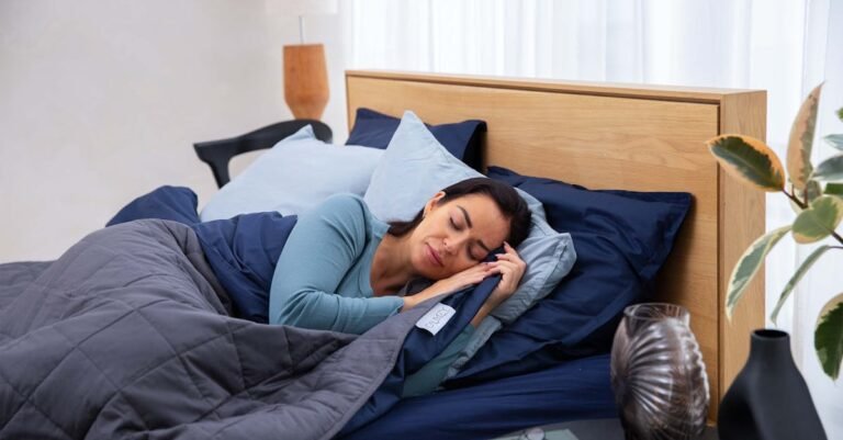 A woman peacefully sleeping on a comfortable bed with soft pillows and a cozy comforter.
